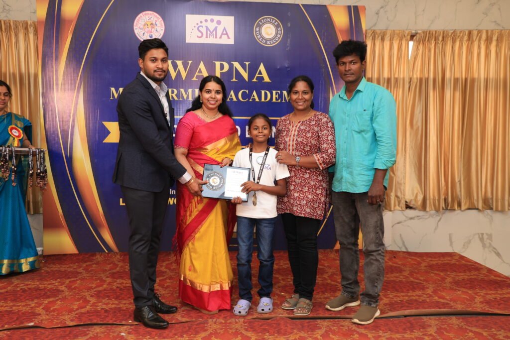 Y. Vegaasri Lionize World Records certificate for performing Silambam while blindfolded and identifying 20 multicolored objects in 1 minute and 27.03 seconds